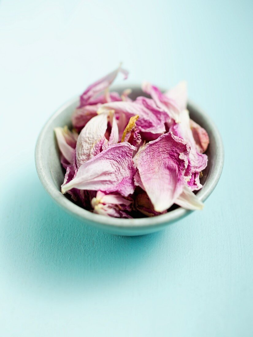 A bowl of dried rose petals