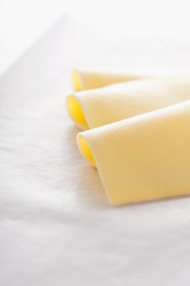 Cheese slices on wax paper