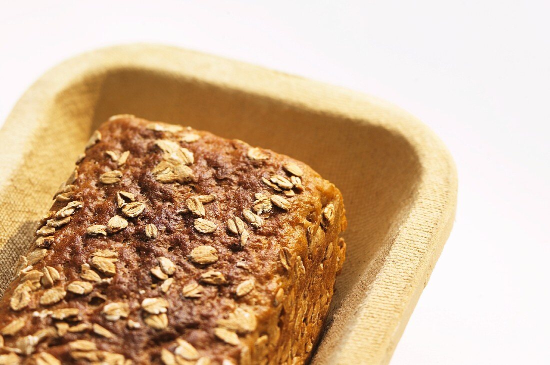 Wholemeal bread with oats in a box