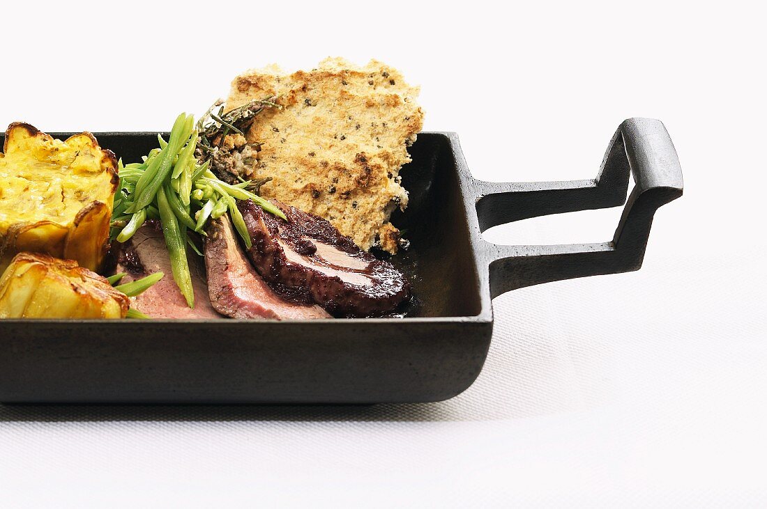 Beef fillet with a salt crust in a cast iron roasting dish