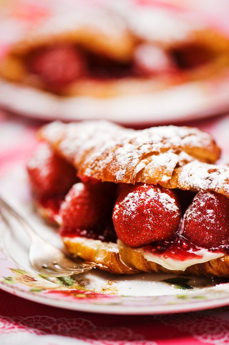 A croissant filled with strawberries