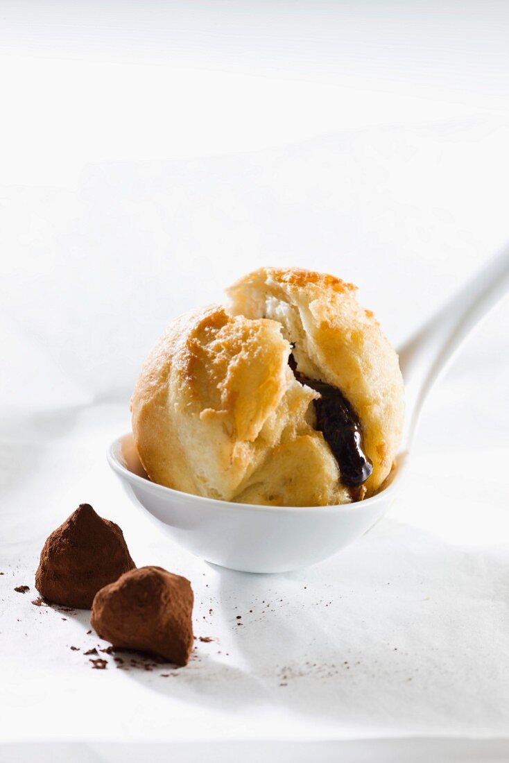 Yeast pasty filled with chocolate with two truffle pralines