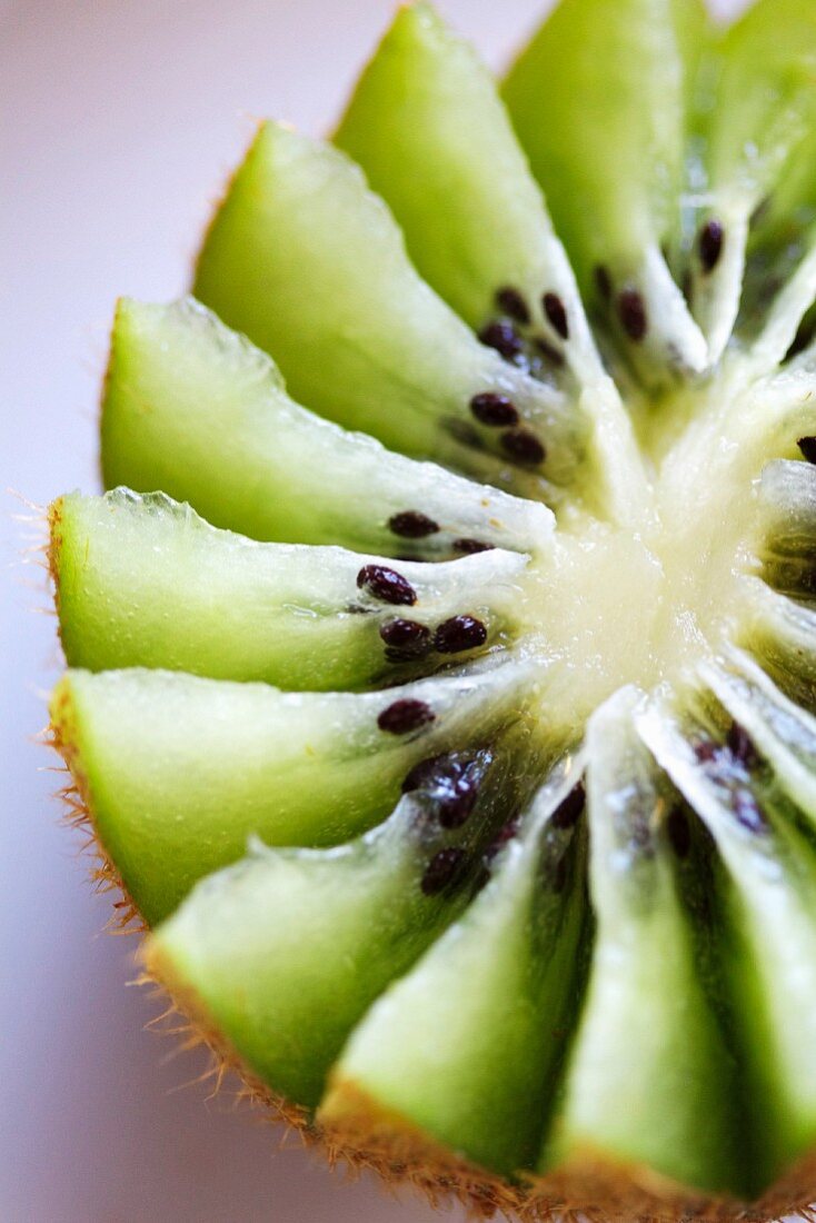 A kiwi half cut into a flower shape