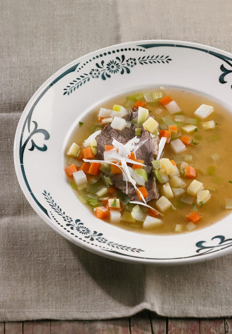 Prime boiled beef in a vegetable broth