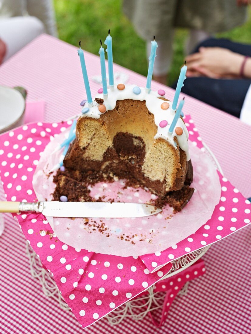 A Nutella birthday cake with some slices removed