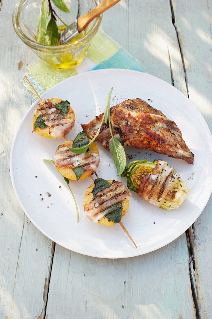 Grilled spare ribs with chicory and apricots wrapped in ham