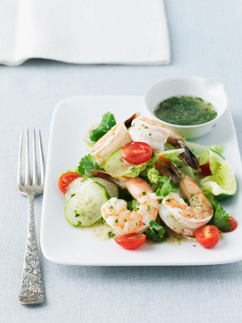 Shrimp Salad on a White Plate with a Small Bowl of Dressing