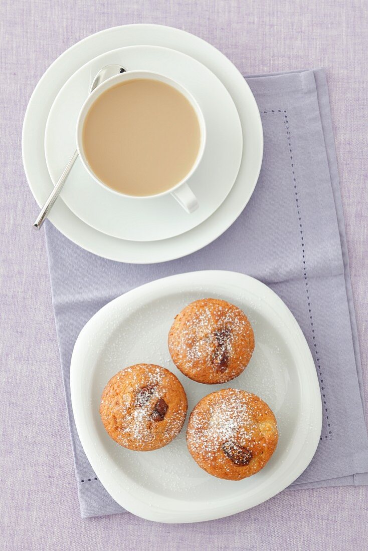 Apple muffins with dried figs and a cup of coffee