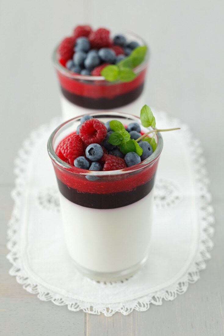 Panna cotta with blackberry and raspberry mousse and blueberries