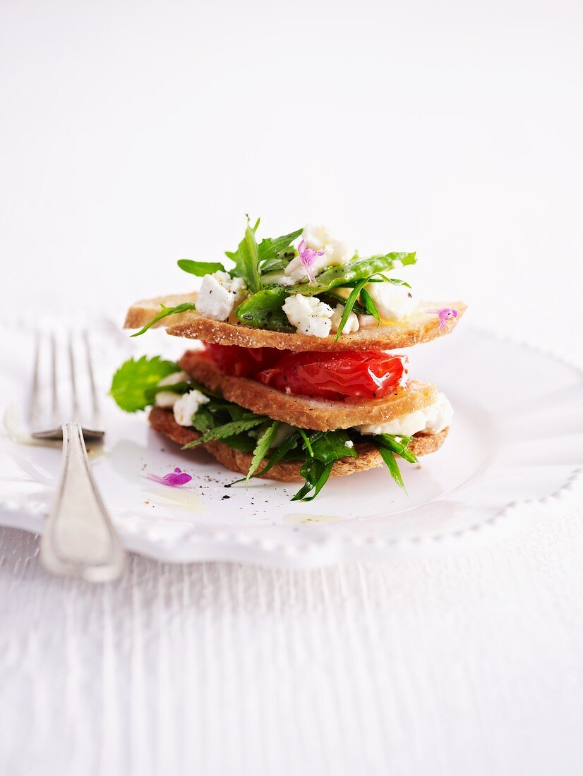 A wild herb salad and goat's cream cheese sandwich