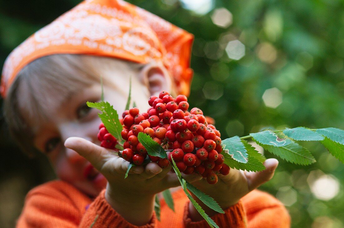 A girl holding fresh berries