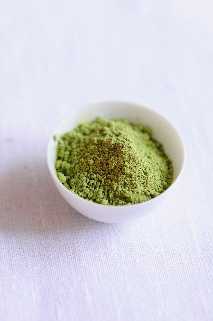 A bowl of matcha tea powder