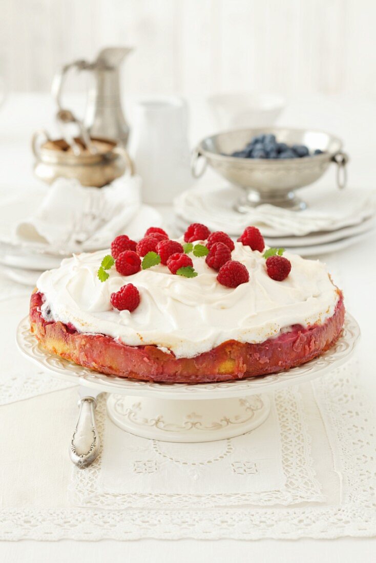 A raspberry cake topped with meringue