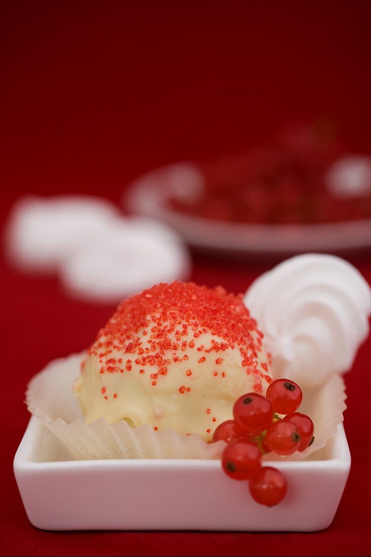 A cake ball (redcurrant meringue)