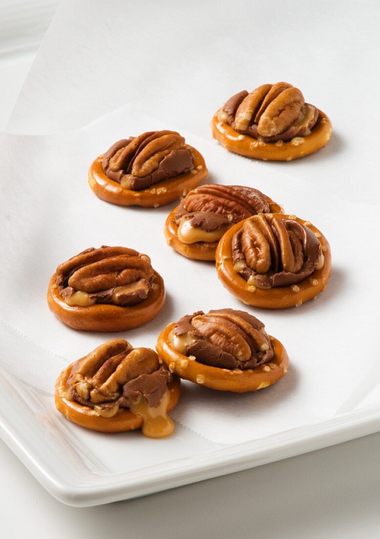 Pretzels with pecan nuts, chocolate and caramel