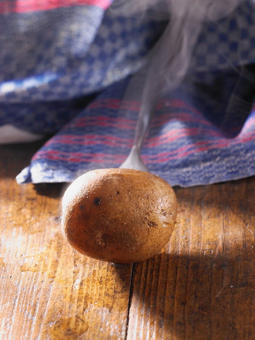 A whole steaming new potato