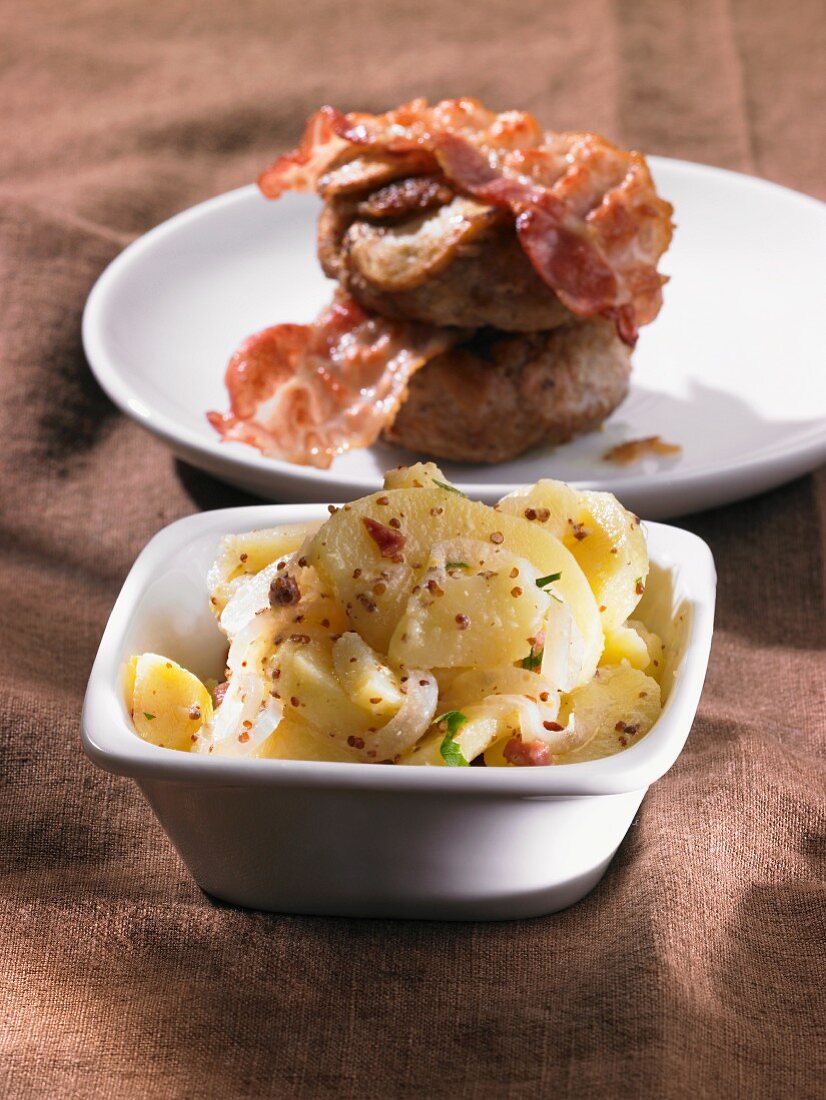 Potato salad with meat balls and bacon
