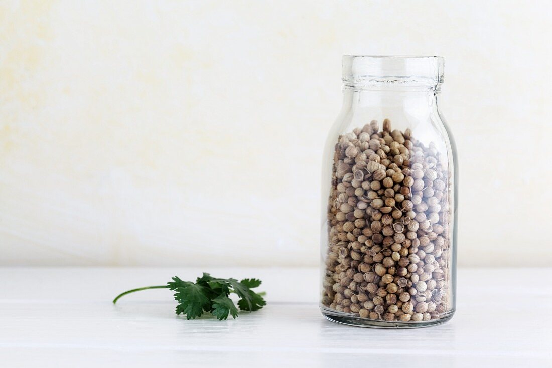 Coriander seeds in a glass jar