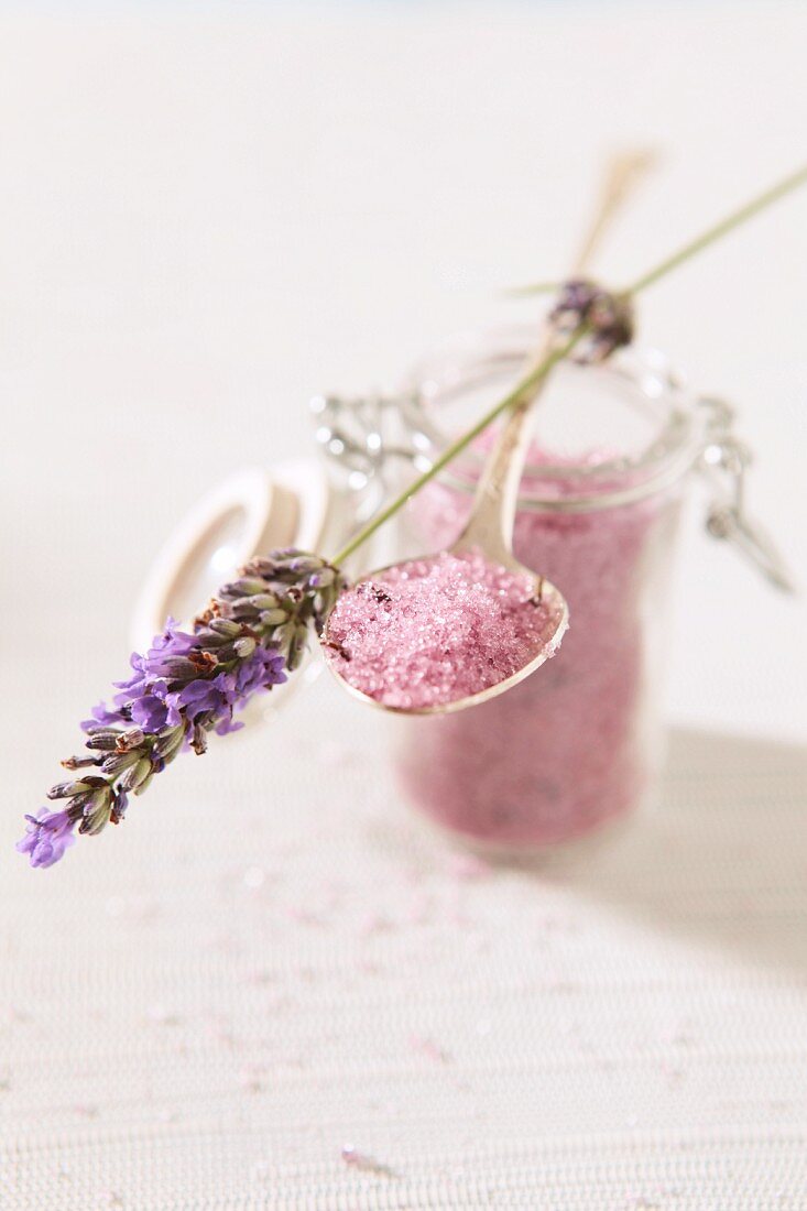 Pink sugar in an open jar with lavender