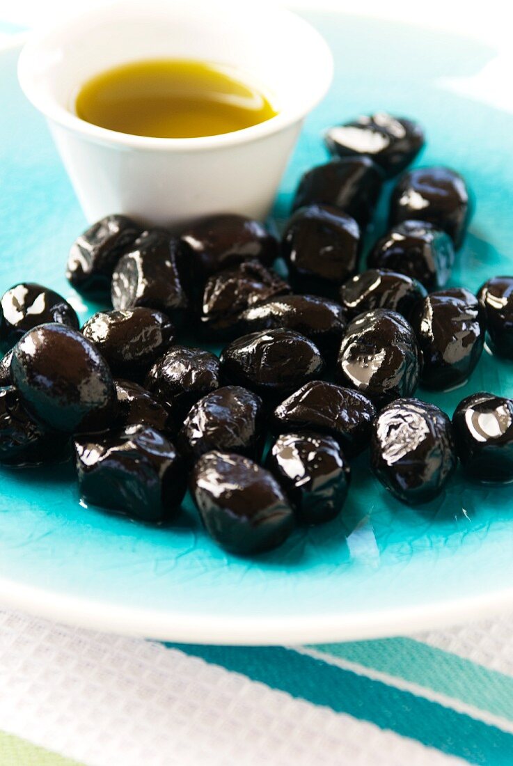 Morrocan Olives with Olive Oil on a Blue Plate