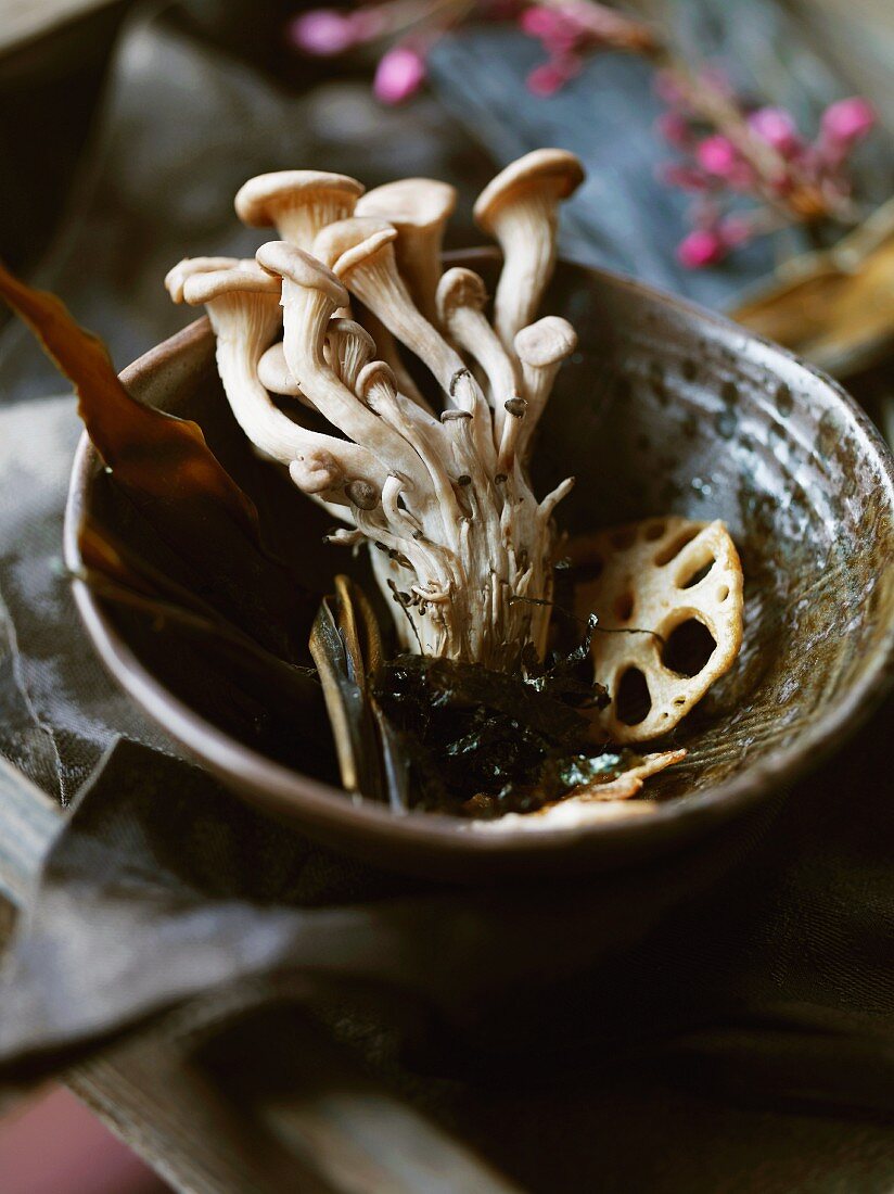 Enoki mushrooms and lotus roots in a bowl