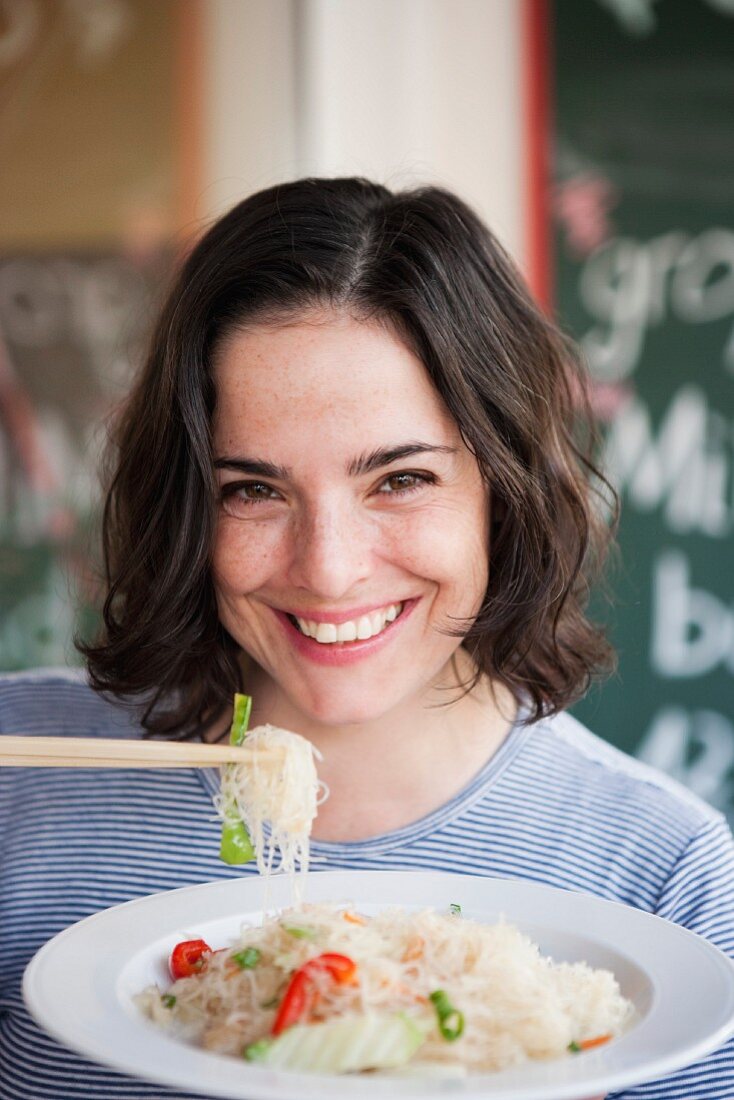 Woman Eating Noodles