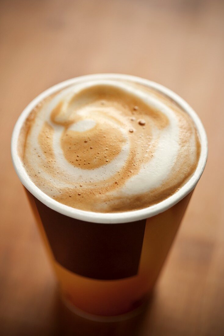 Cappuccino with a Swirl in Take Out Cup