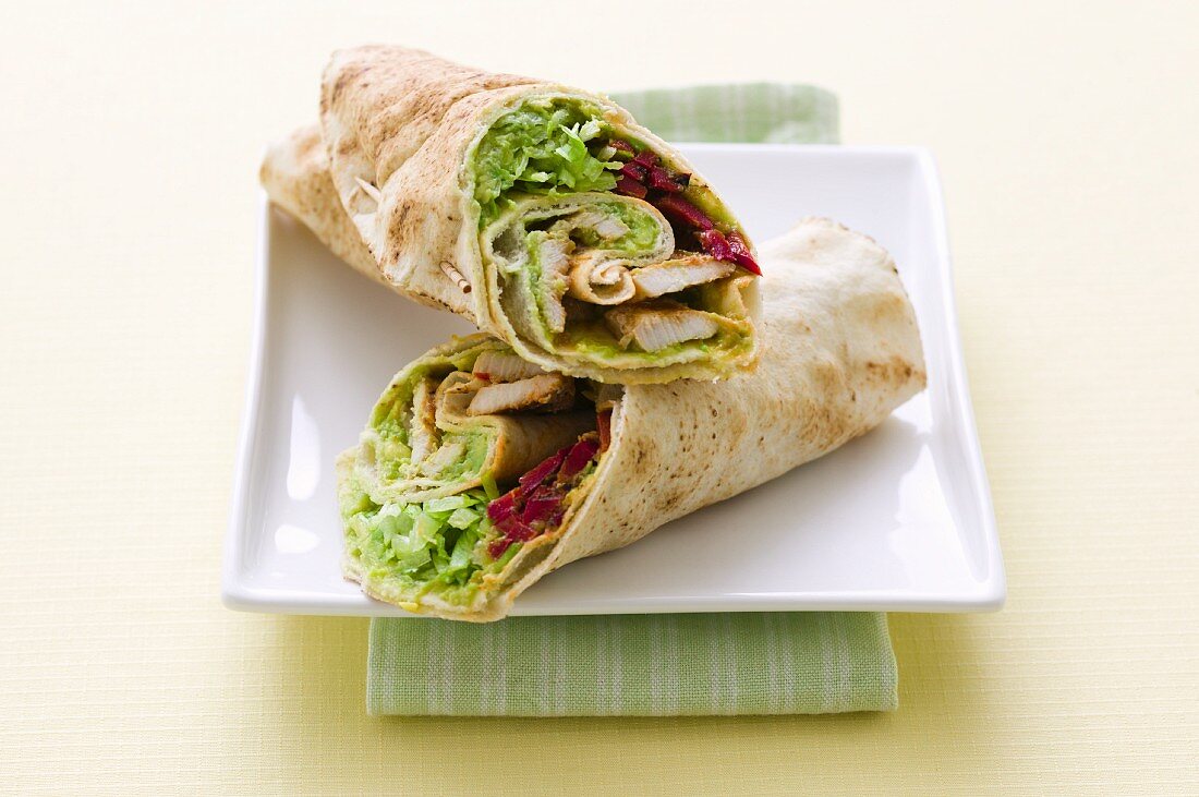 Wraps with grilled chicken, avocado and red beets