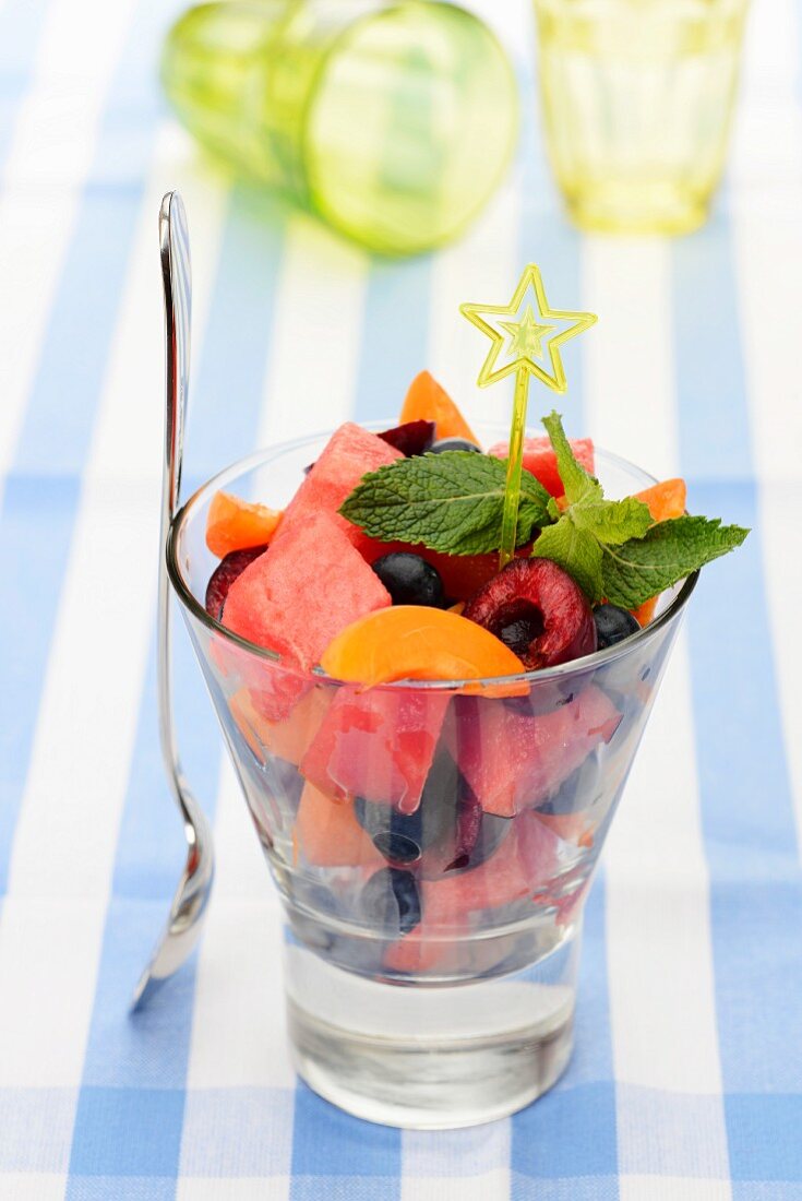 Fruit salad in a glass with mint