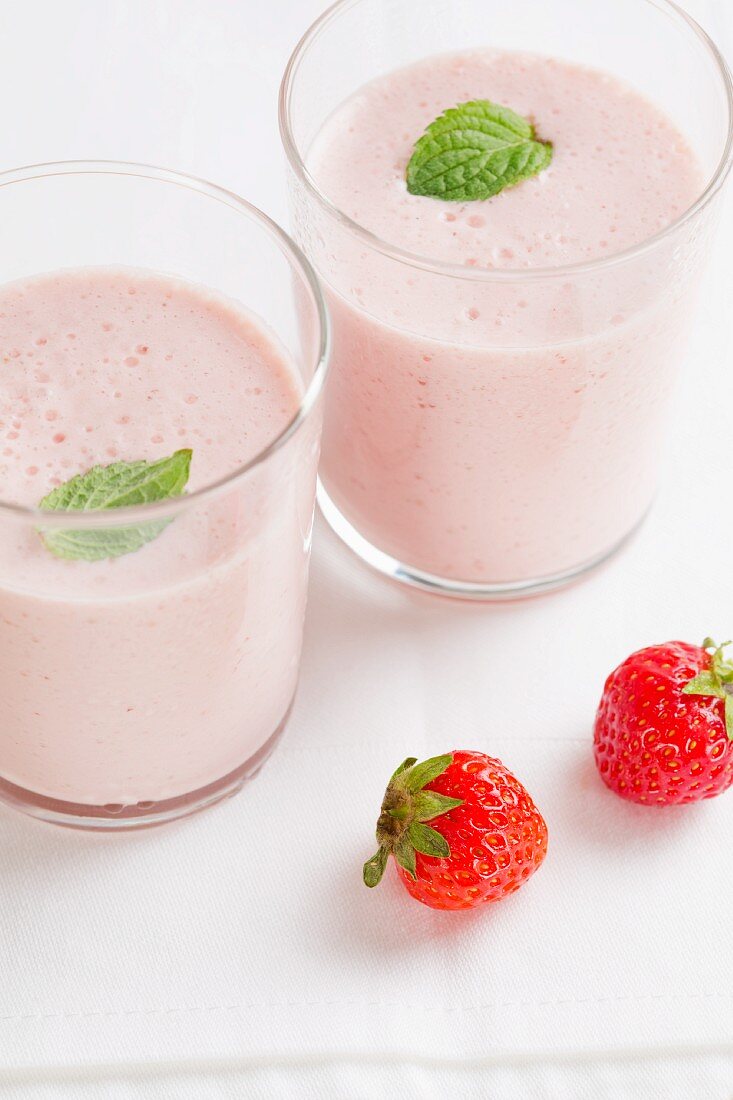 Two strawberry milkshakes