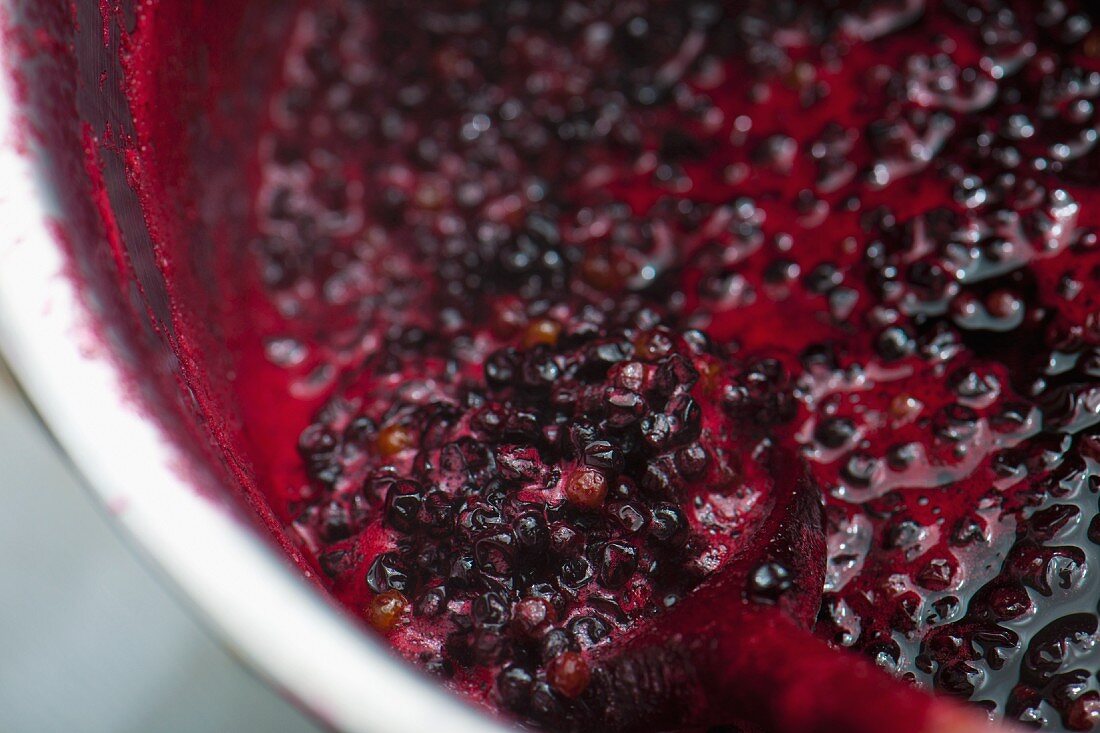 Elderberry jam in a pot (close-up)