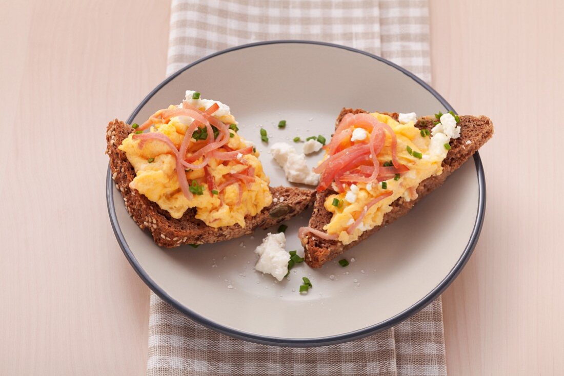 Scrambled egg with ham and feta cheese on wholemeal bread