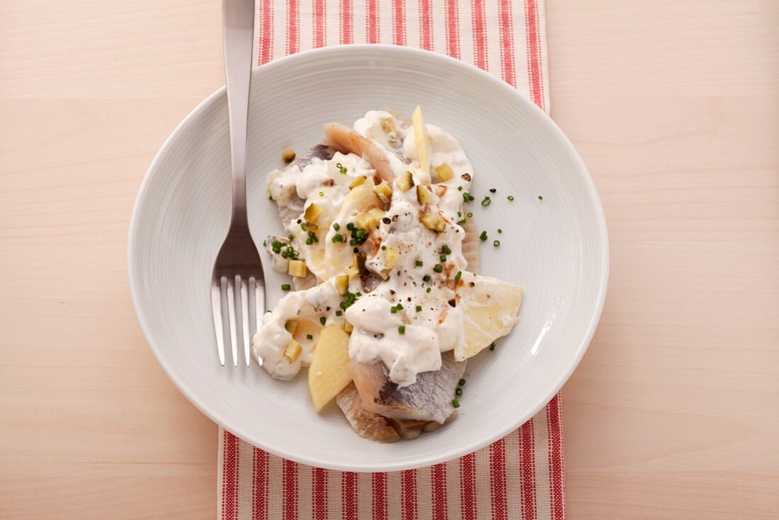 Soused herring with a creamy spiced sauce made with apples and yogurt