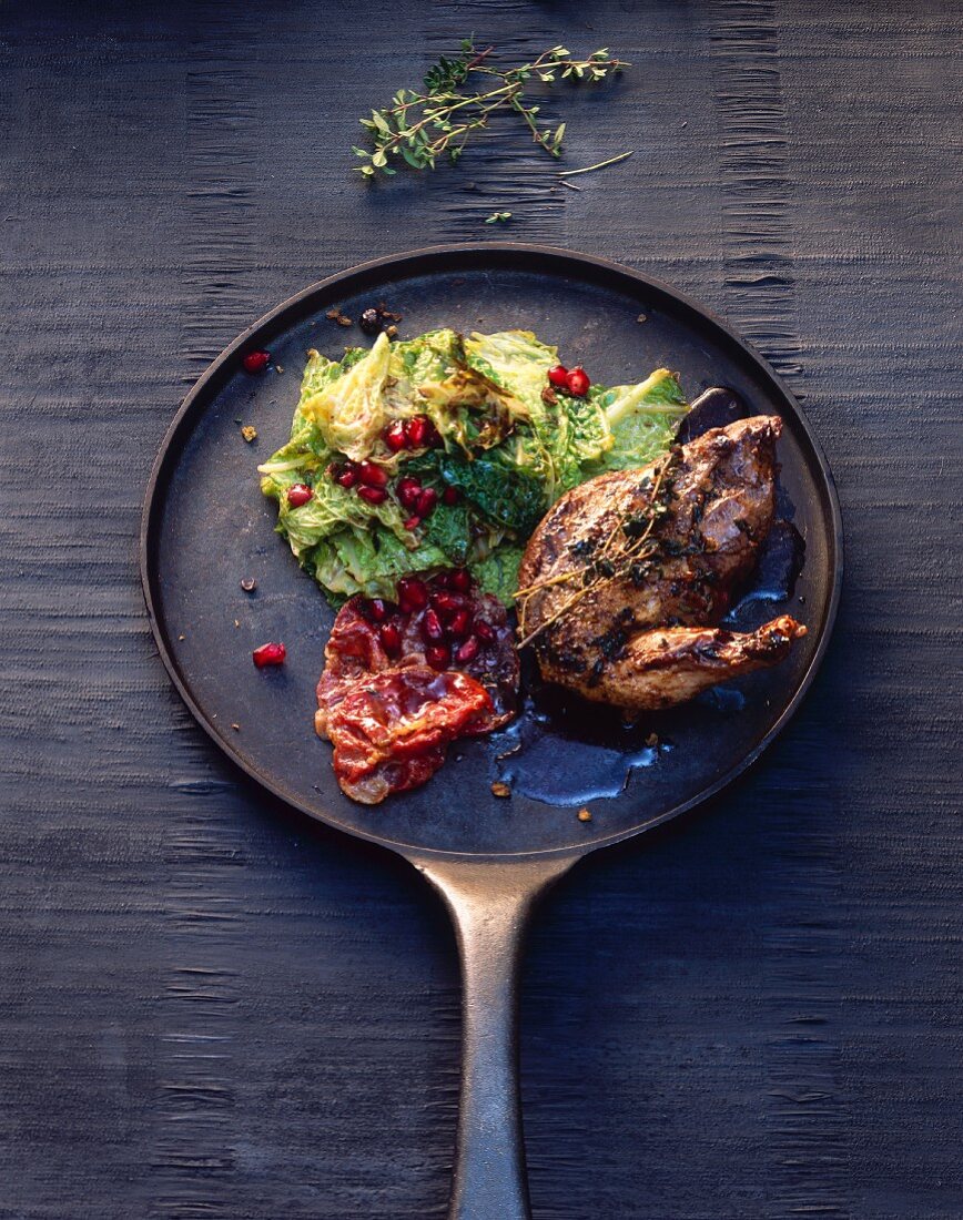 Pheasant breast with savoy cabbage and pomegranate seeds