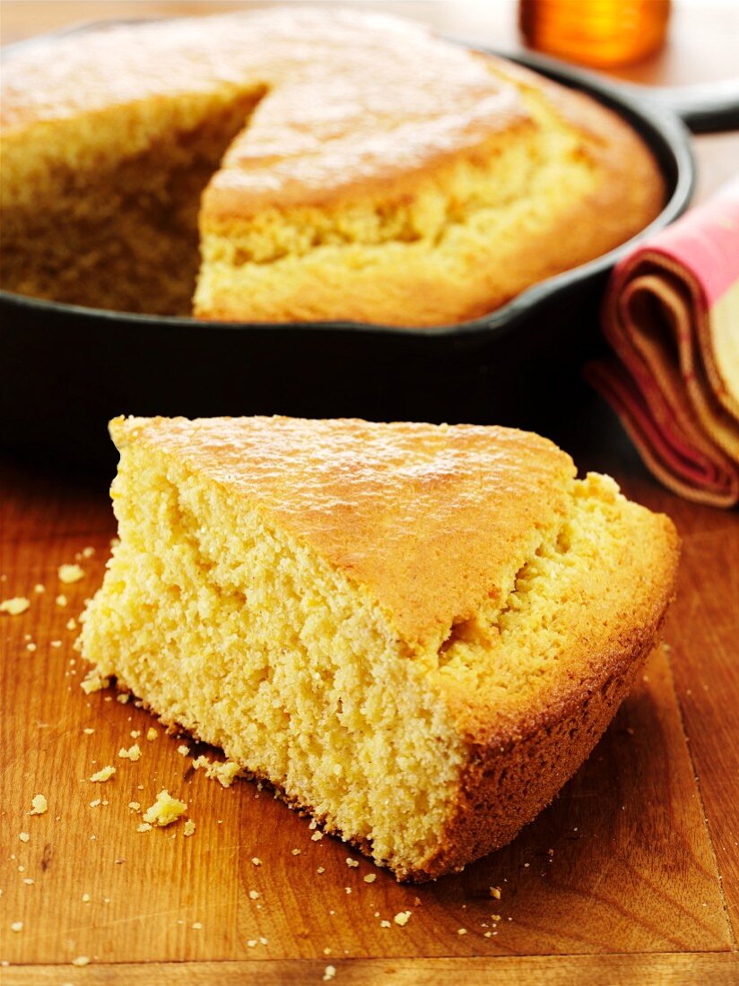 Slice of Corn Bread Cooked in a Cast Iron Skillet