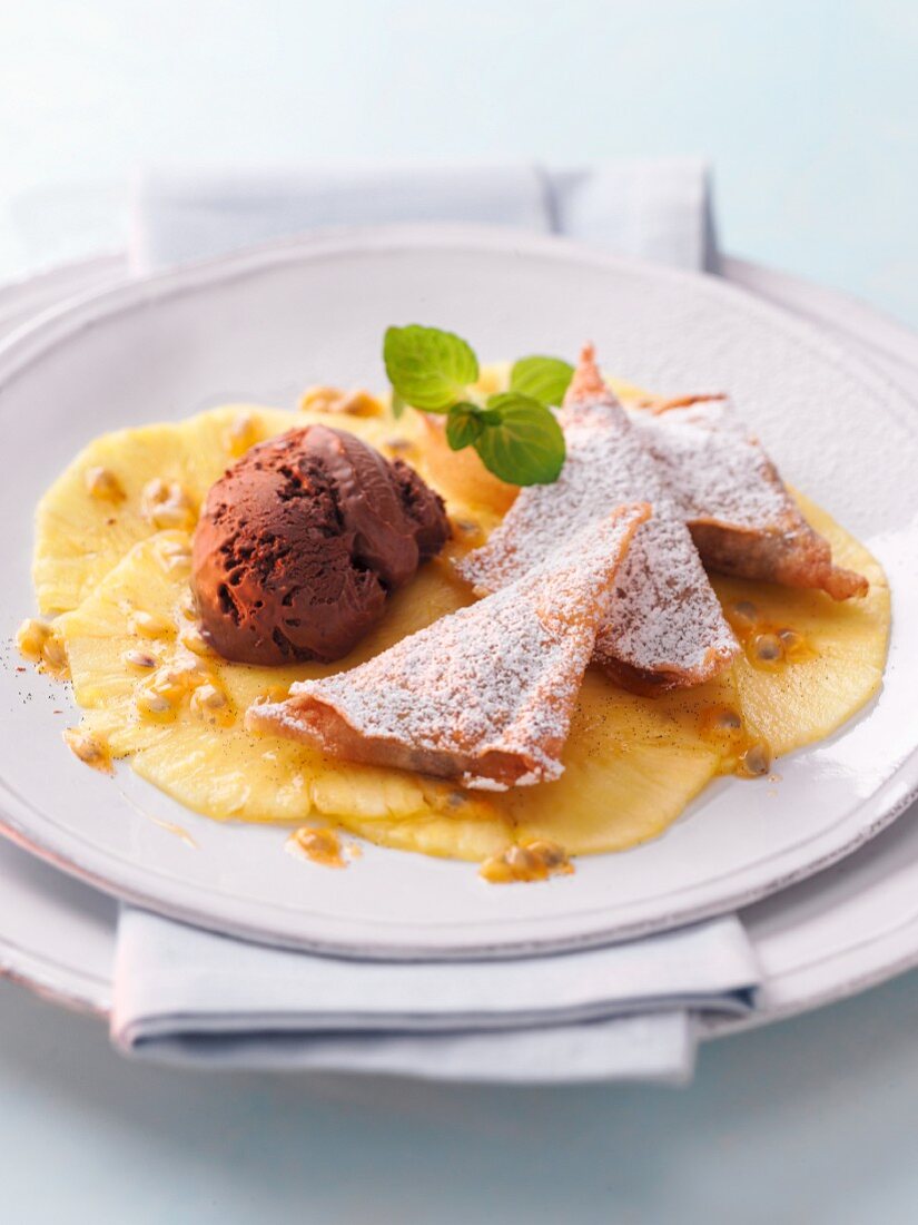 Fried chestnut pockets and chocolate ice cream on pineapple carpaccio