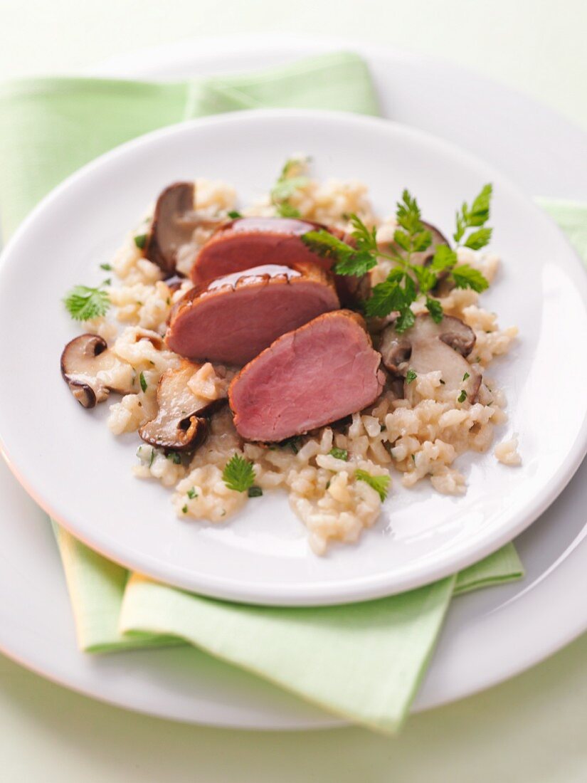 Pork fillet on porcini mushroom risotto