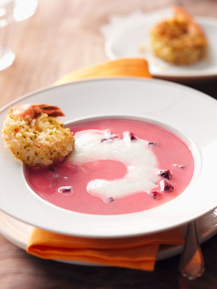 Beetroot soup with sour cream and breaded prawns
