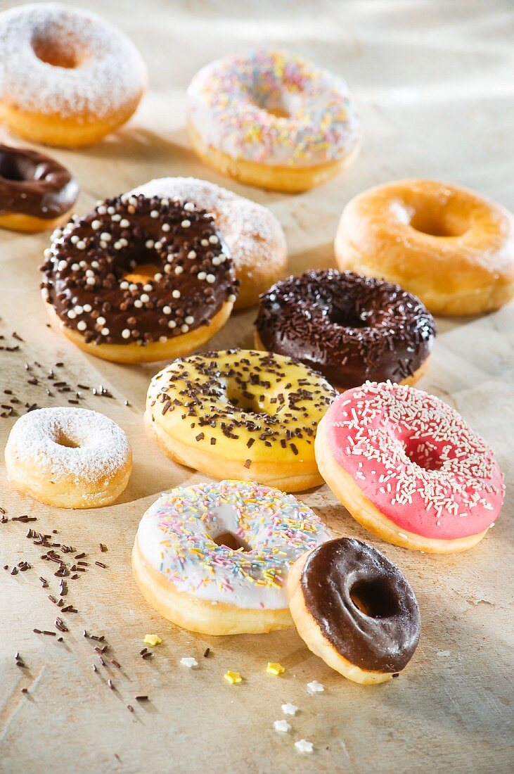 Doughnuts with colourful glaze and sugar sprinkles