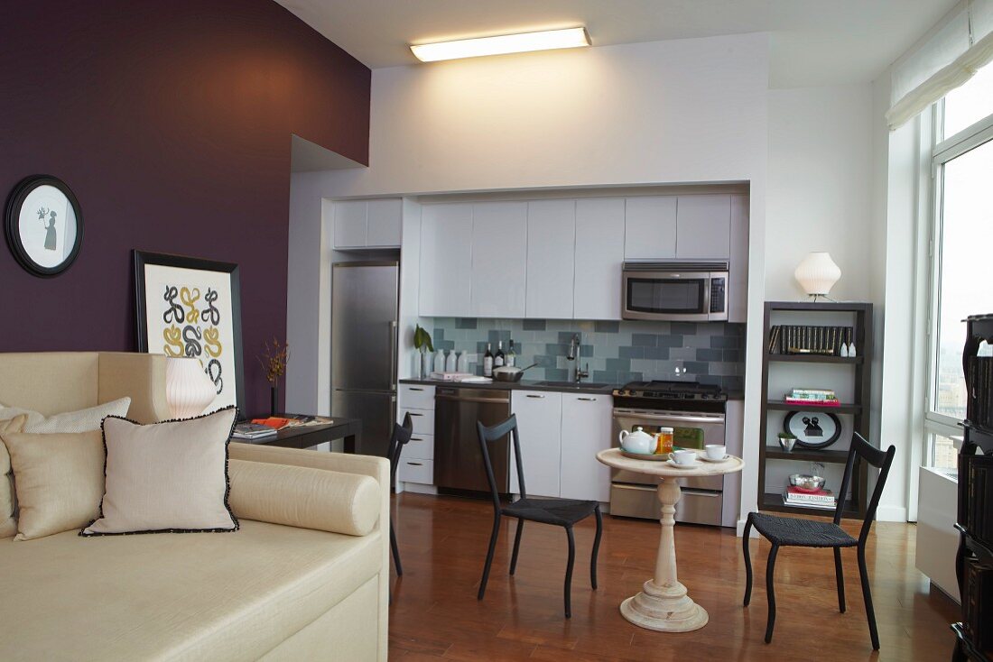 Living Room and Kitchen Interior with Purple Accent Wall