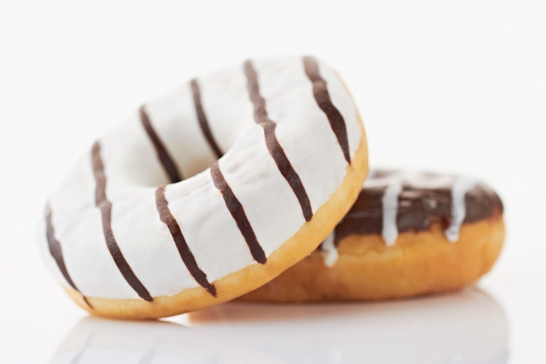 Two black and white doughnuts