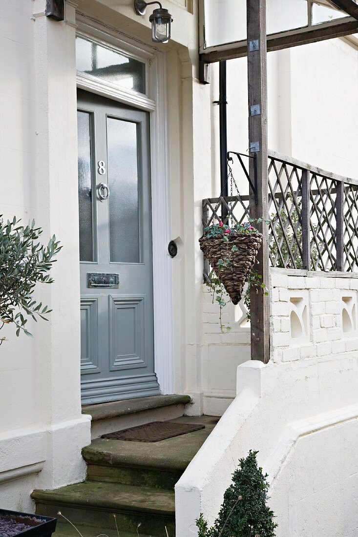 Front door of Victorian town house with house number