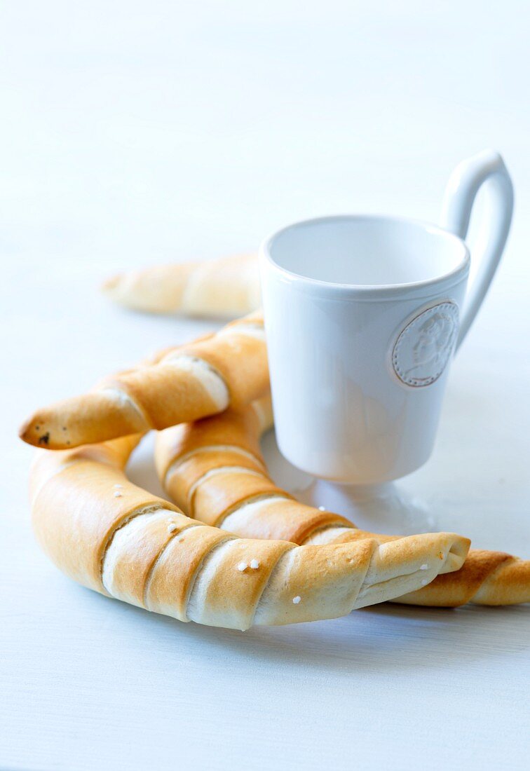 Salted pastries and a cup
