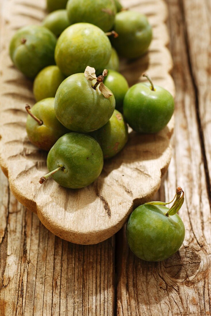Greengages in a wooden bowl