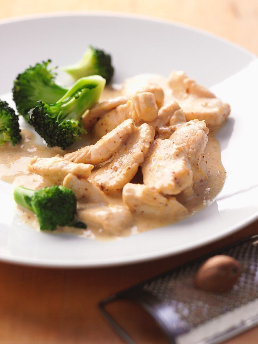 Chicken fillet in a mustard sauce with broccoli