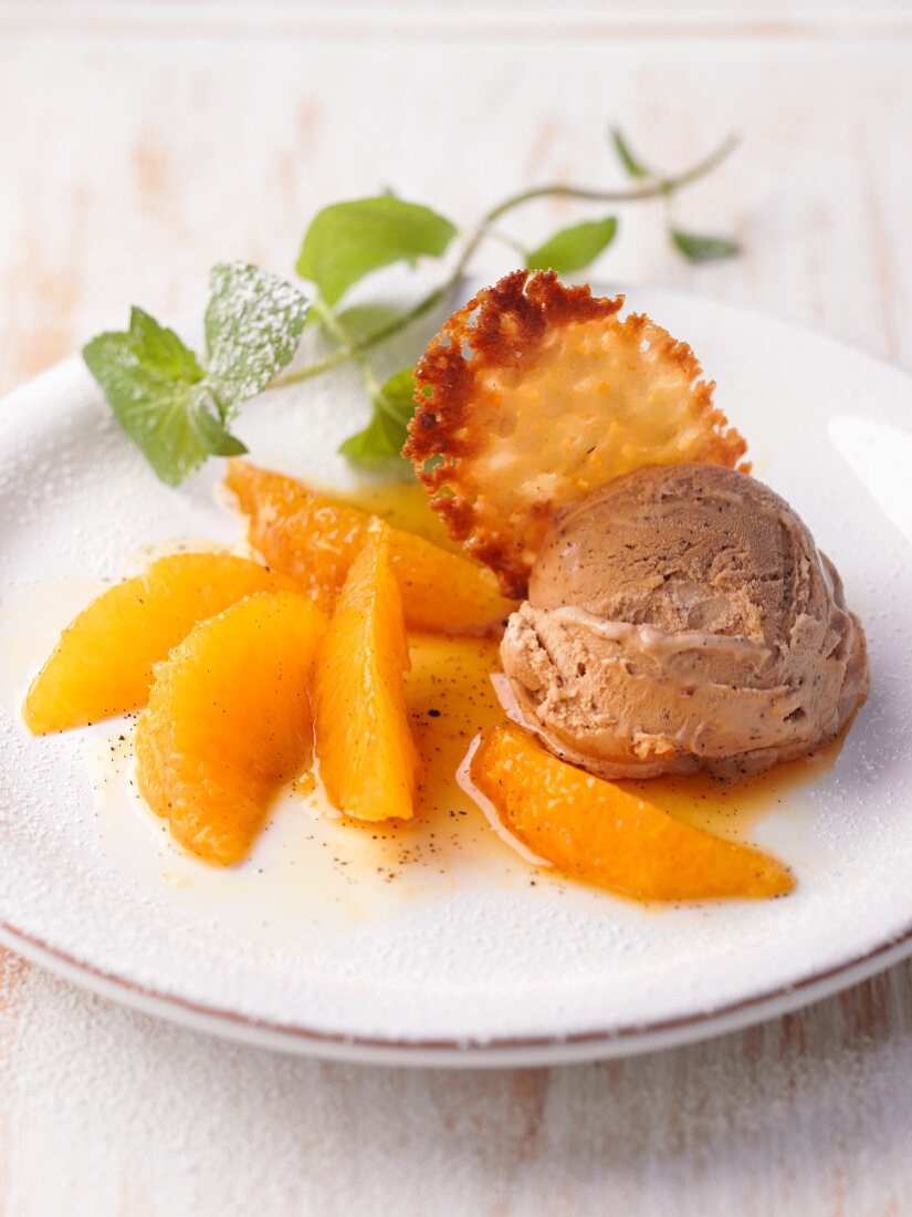 Mocha ice cream with orange ragout and a wafer