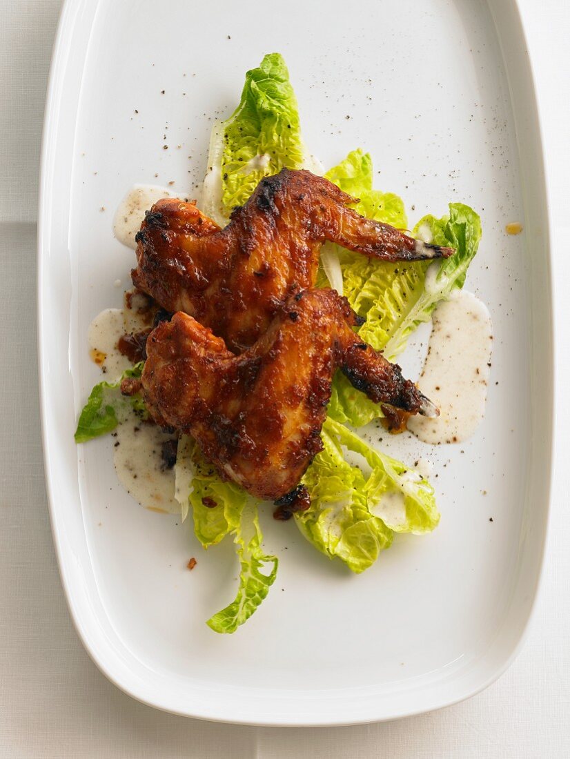 Chicken wings on a bed of lettuce