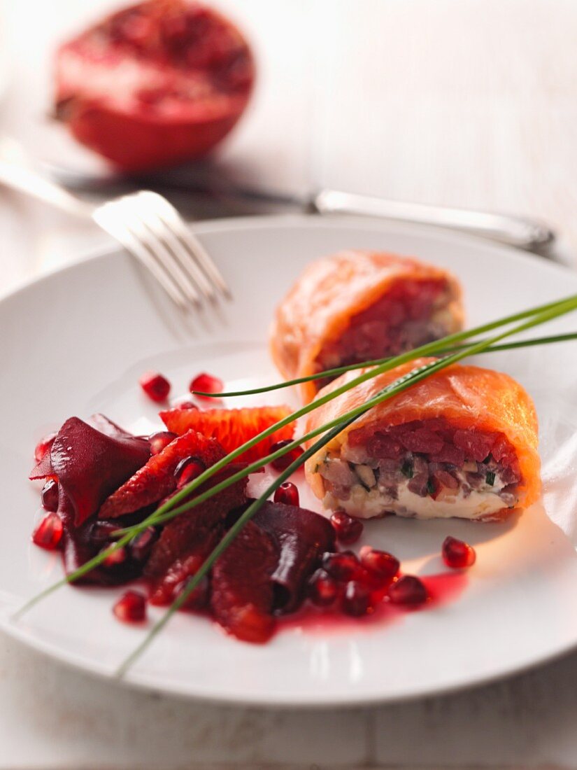 Fish rolls with a beetroot and pomegranate salad