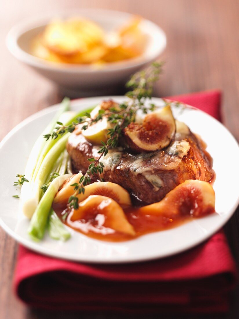 Beef fillet with a gorgonzola crust, fig sauce, celery and thyme