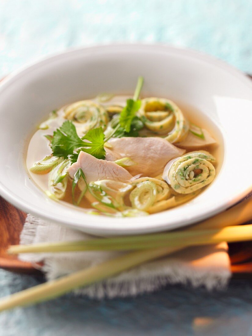 Lemongrass soup with chicken and pancake rolls